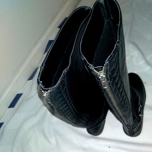 Tall black boots